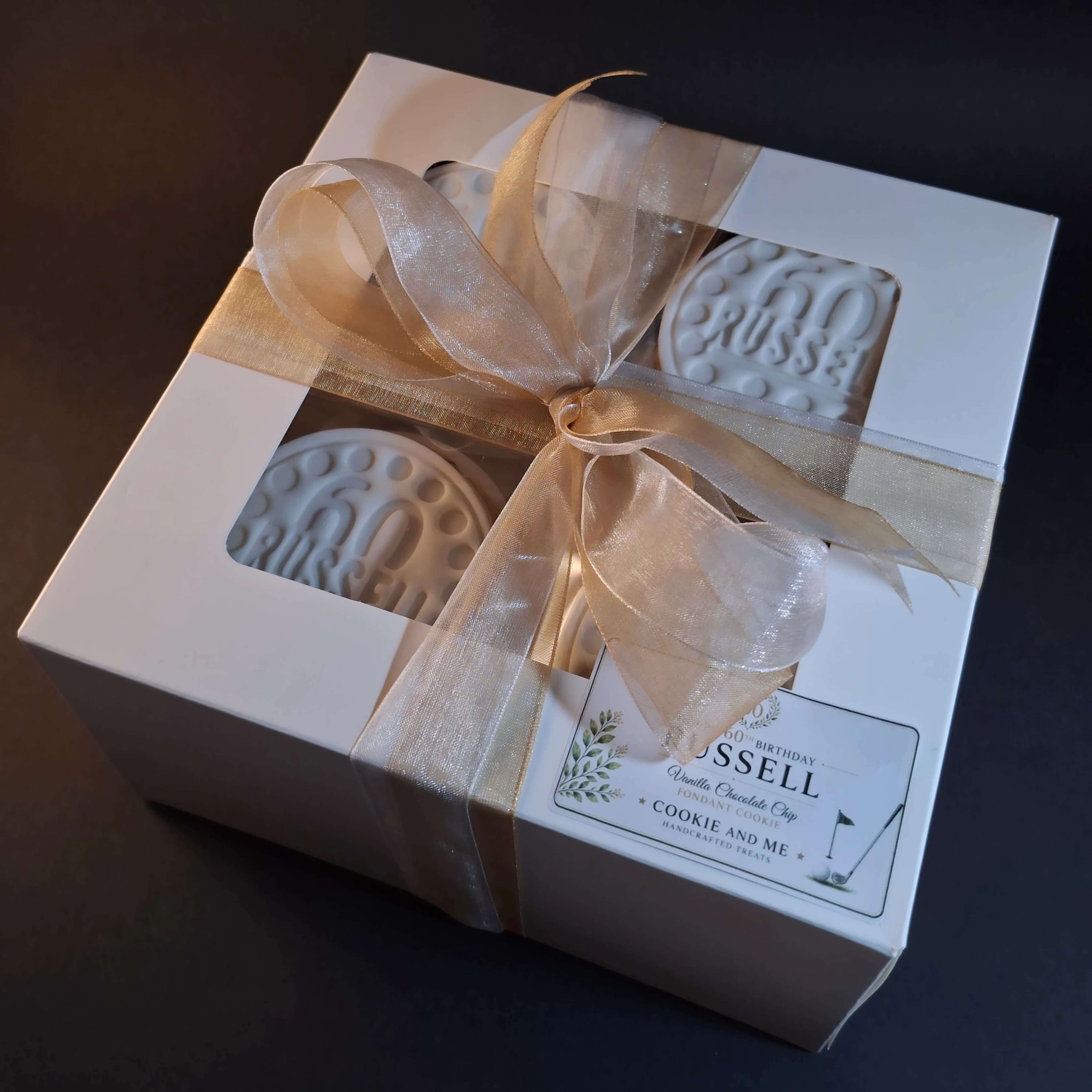 60th birthday cookies in gift box with gold ribbon