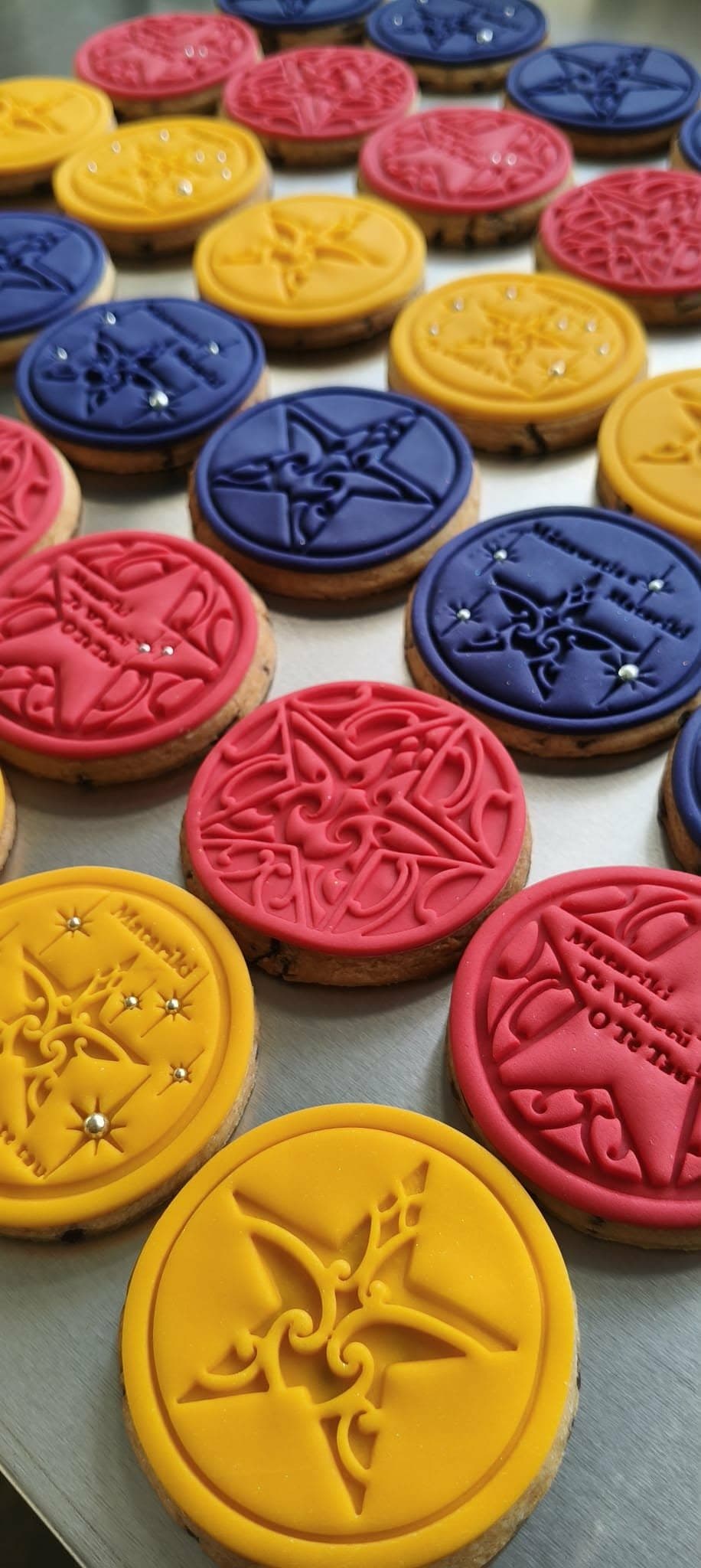 Matariki cookies in pink, blue and yellow
