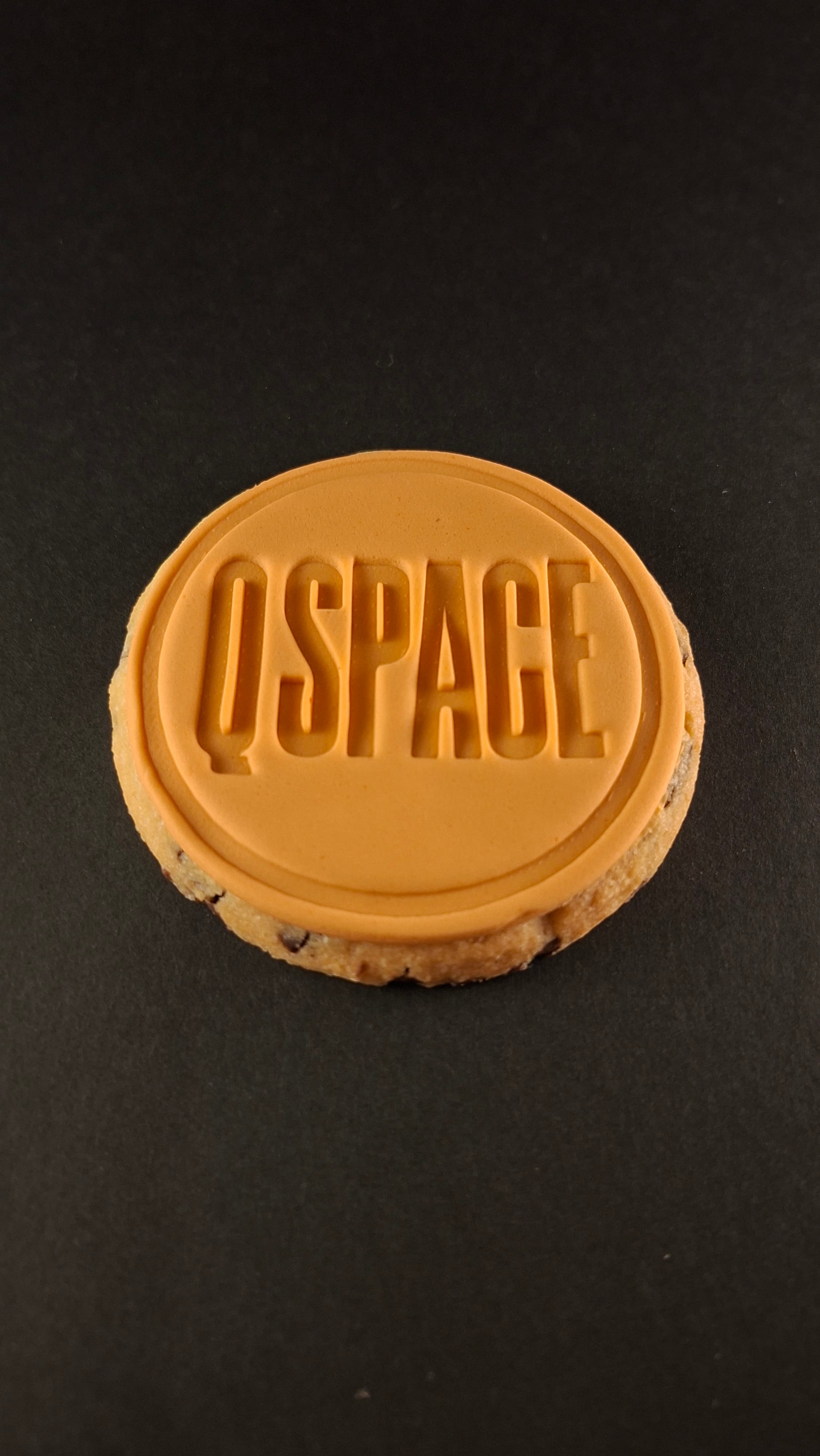 Branded cookie stamped with a company logo