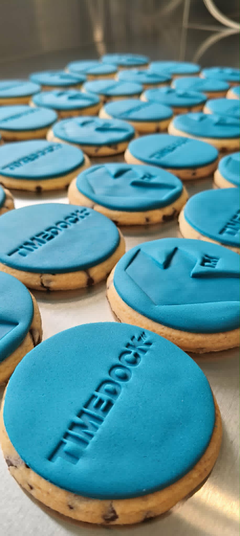 TimeDock branded cookies on production bench